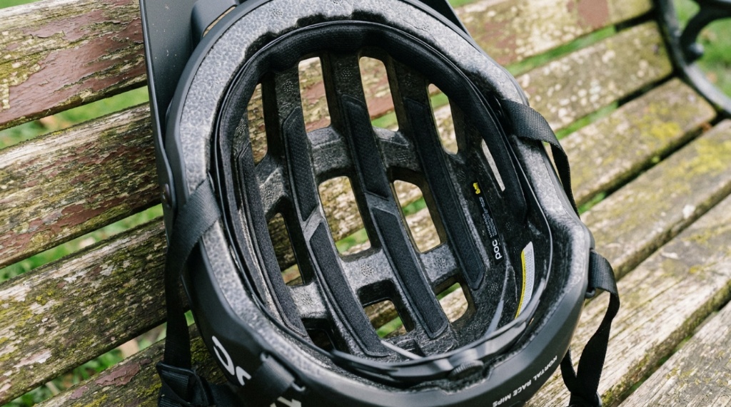 Close-up of cooling vents on a lightweight mountain bike helmet.